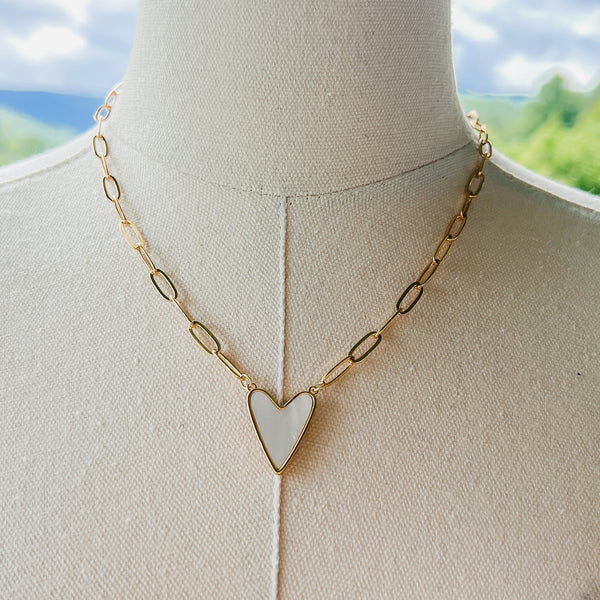 gold paperclip chain necklace with white enamel heart charm