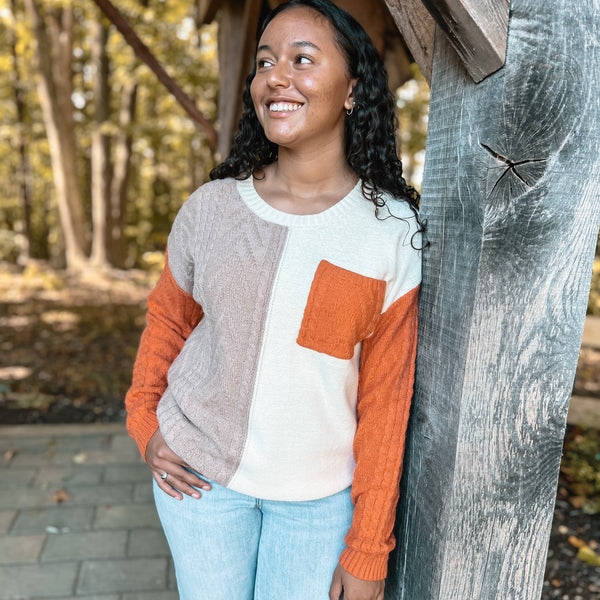 orange tan ivory color block sweater with pocket